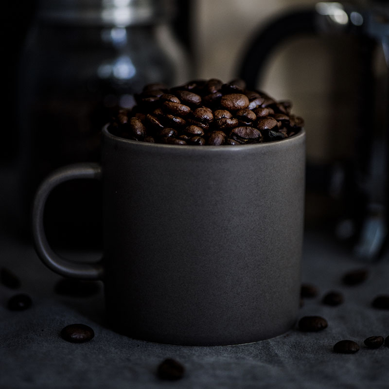white ceramic mug fill with coffee